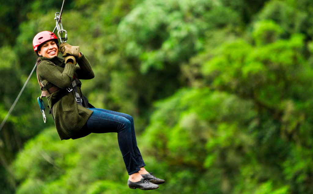 Woman riding zipline attraction in Pigeon Forge