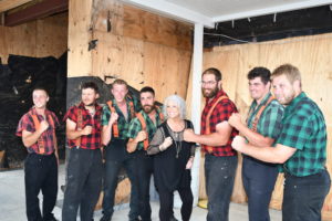 Paula Deen standing with lumberjacks